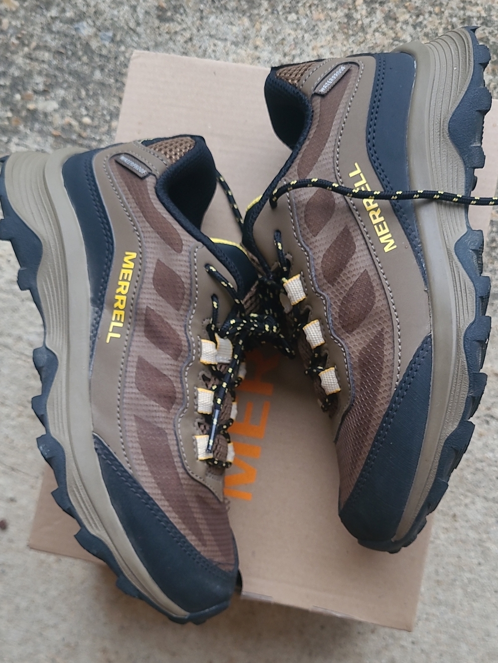 Merrell Men's Brown and Black Trail Running Shoes with Yellow Logo